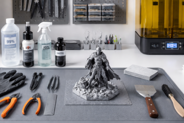 organized 3D printing post-processing workstation with silicone mat, tools, resin print, and cleaning supplies for safe and clean workspace