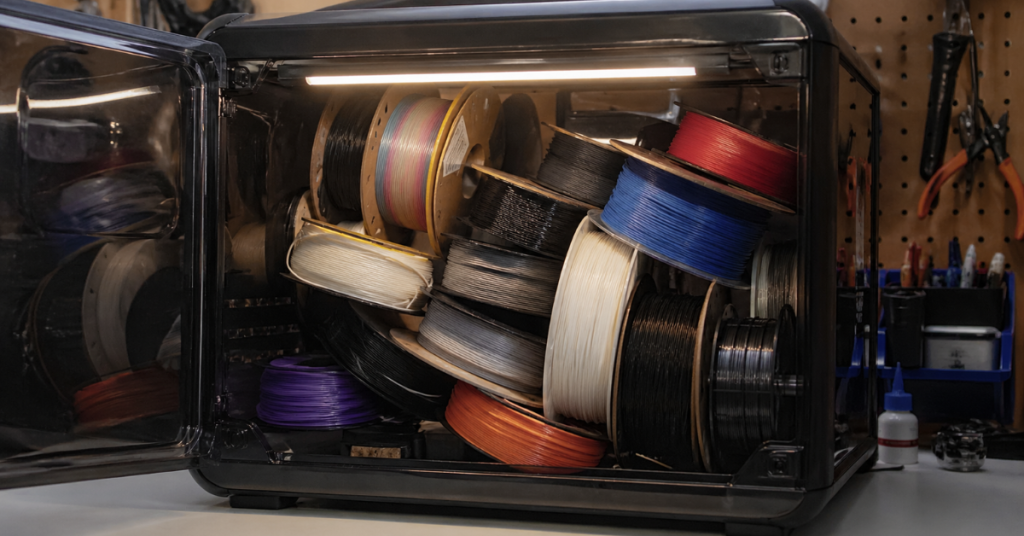Overloaded filament dryer packed with multiple spools causing uneven drying and poor airflow